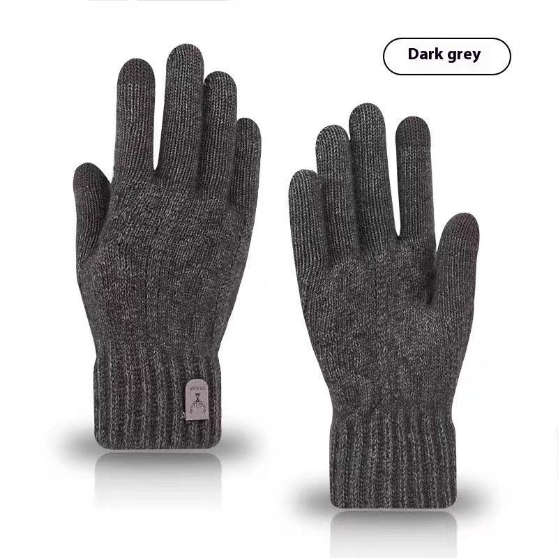 Pair of dark grey knit wool gloves with ribbed cuffs on white background