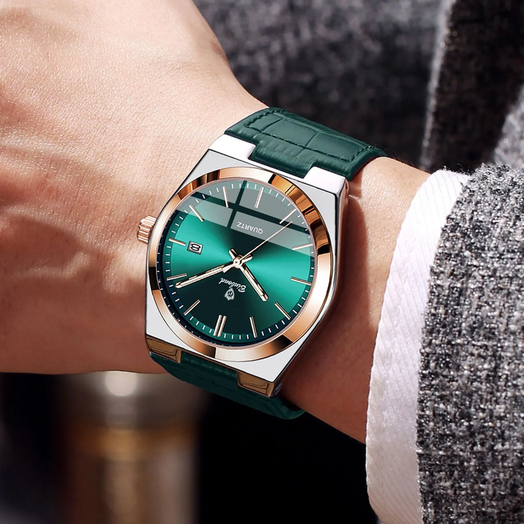 Close-up of a wrist wearing a green dial quartz watch with gold accents and green leather strap