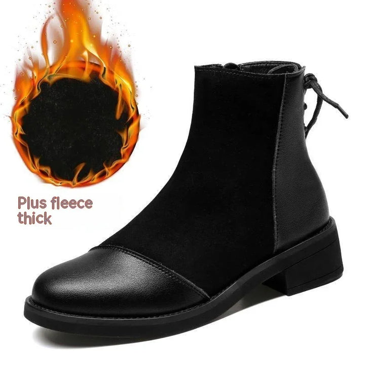 black ankle boot with leather toe cap and thick fleece lining, fire graphic indicating warmth