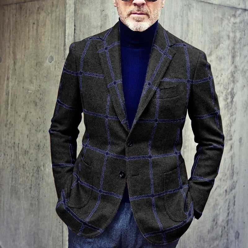 Man wearing dark gray blazer with blue windowpane pattern and navy turtleneck sweater