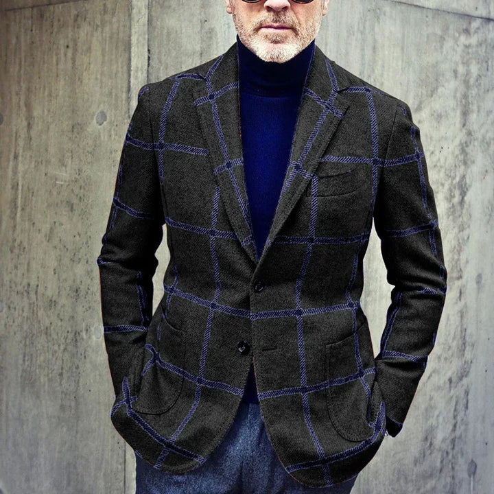 Man wearing dark gray blazer with blue windowpane pattern and navy turtleneck sweater