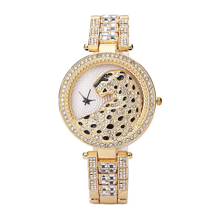 Gold-tone women's wristwatch with crystal-studded leopard design and decorative band
