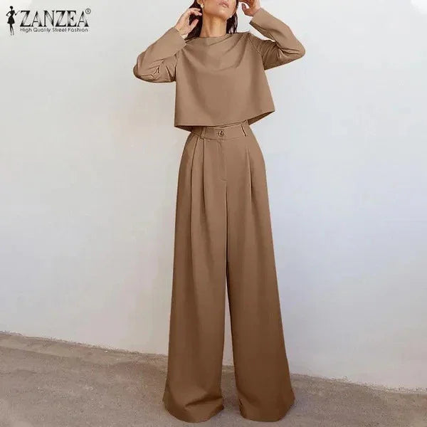 woman wearing camel brown two-piece outfit with long sleeve cropped top and high-waist wide-leg pants
