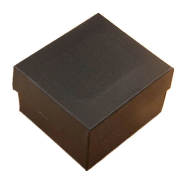 Small black textured gift box with lid on a white background