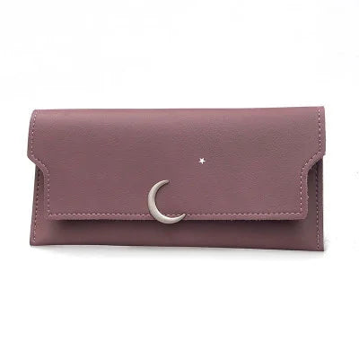 Mauve leather wallet with silver crescent moon and star embellishments on front flap