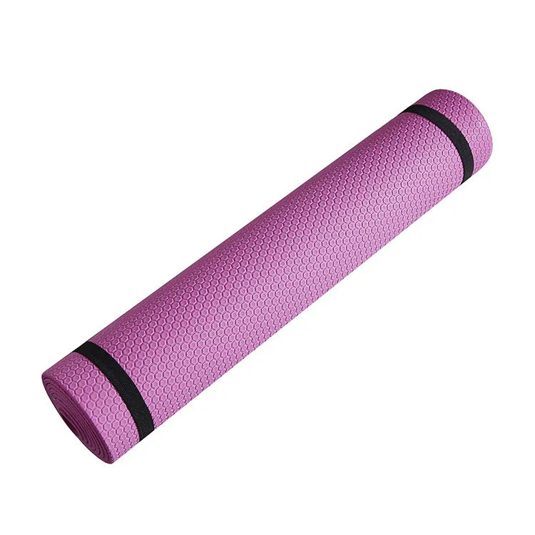 Purple textured yoga mat with black straps, fitness accessory on white background