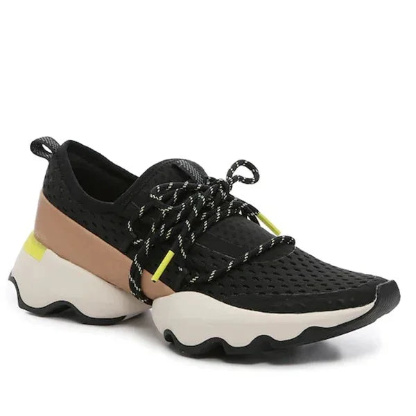 Black mesh sneaker with chunky white sole, tan band, and yellow accents, athletic shoe