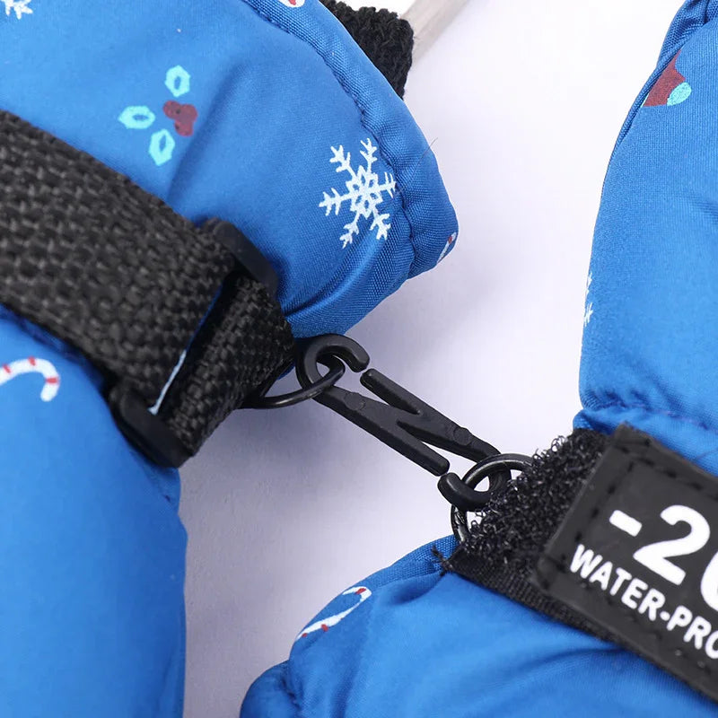 Blue winter gloves with snowflake pattern and black clip connecting them