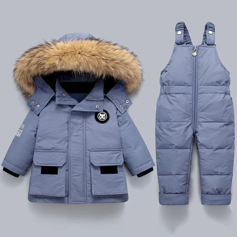 Blue toddler winter jacket with faux fur hood and matching insulated snow bib overalls