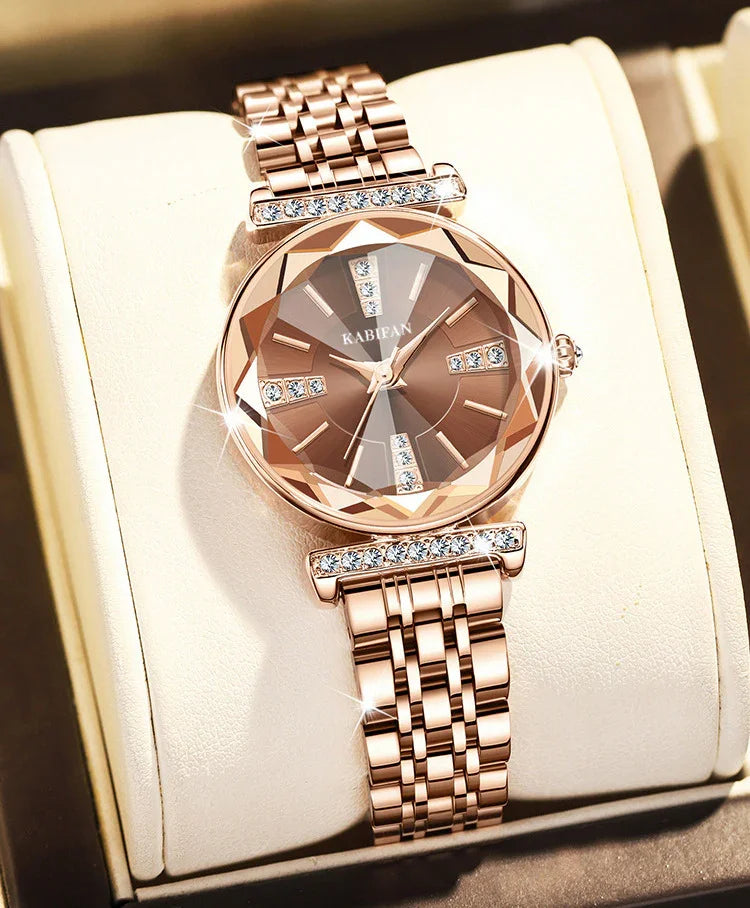 Rose gold women's wristwatch with diamond accents and faceted crystal face in display box