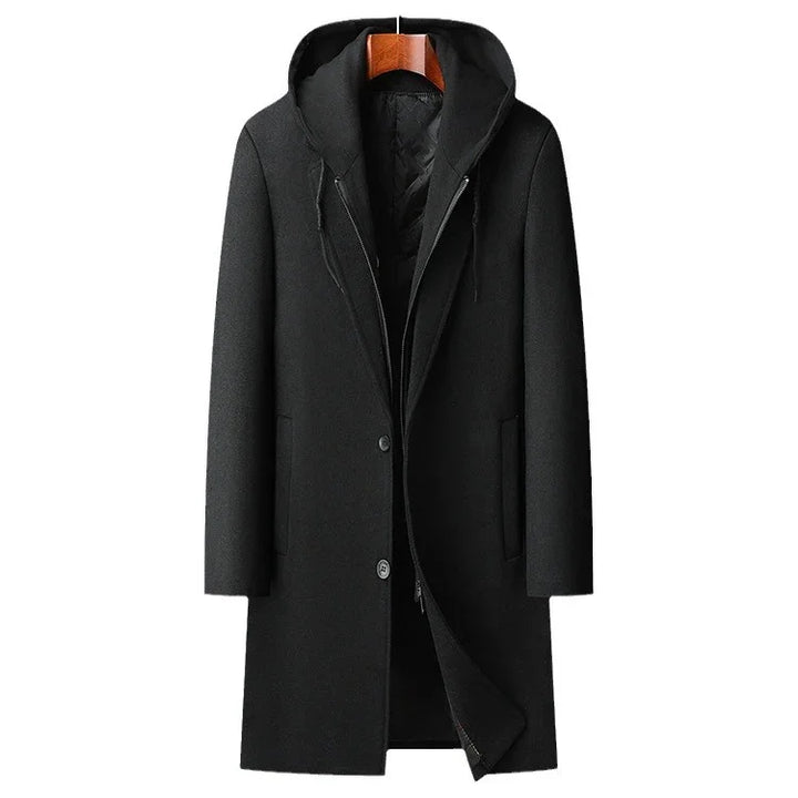 Black long wool hooded coat with zipper and button closure on wooden hanger
