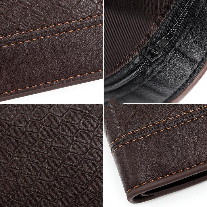 Close-up of dark brown textured leather wallet with orange stitching and black zipper detail