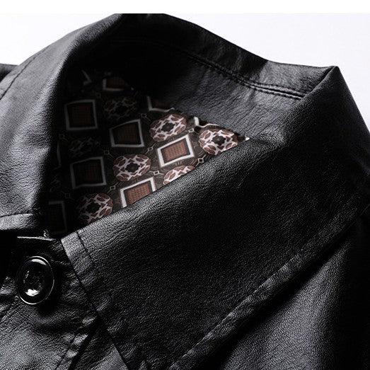 Close-up of black leather jacket collar with patterned inner lining and button detail