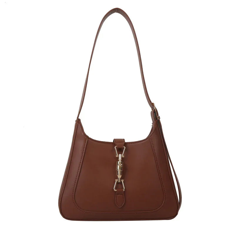 Brown leather shoulder bag with gold-tone clasp and adjustable strap on white background