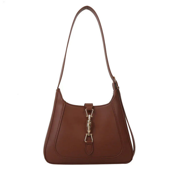 Brown leather shoulder bag with gold-tone clasp and adjustable strap on white background