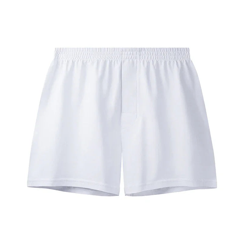 Plain white men's boxer shorts with elastic waistband on a white background