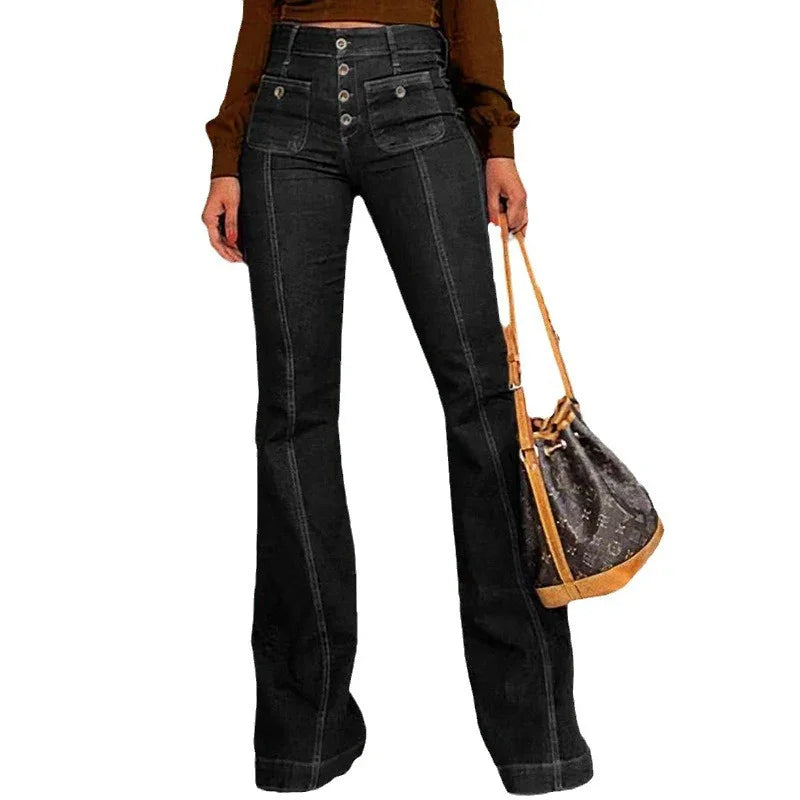 Woman wearing high-waisted black flare jeans with button fly and patch pockets, holding brown designer handbag