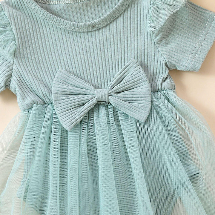 Light blue ribbed knit baby dress with mesh tutu skirt and large bow detail at waist