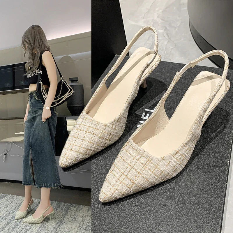 Beige plaid slingback pointed toe heels on black box and worn with denim skirt and black crop top