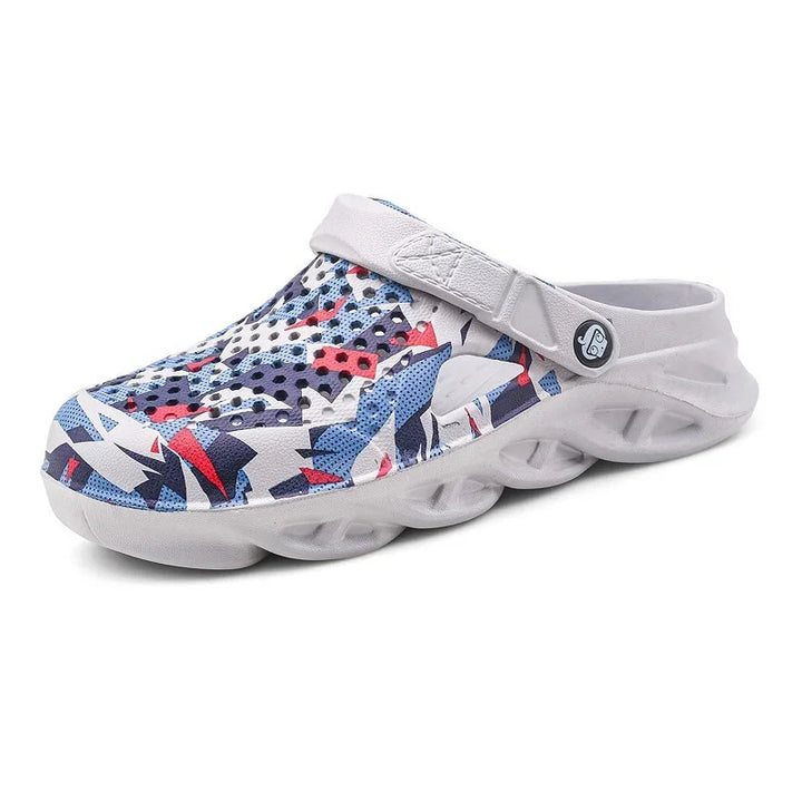 Colorful ventilated clog sandal with adjustable white strap and patterned blue red accents