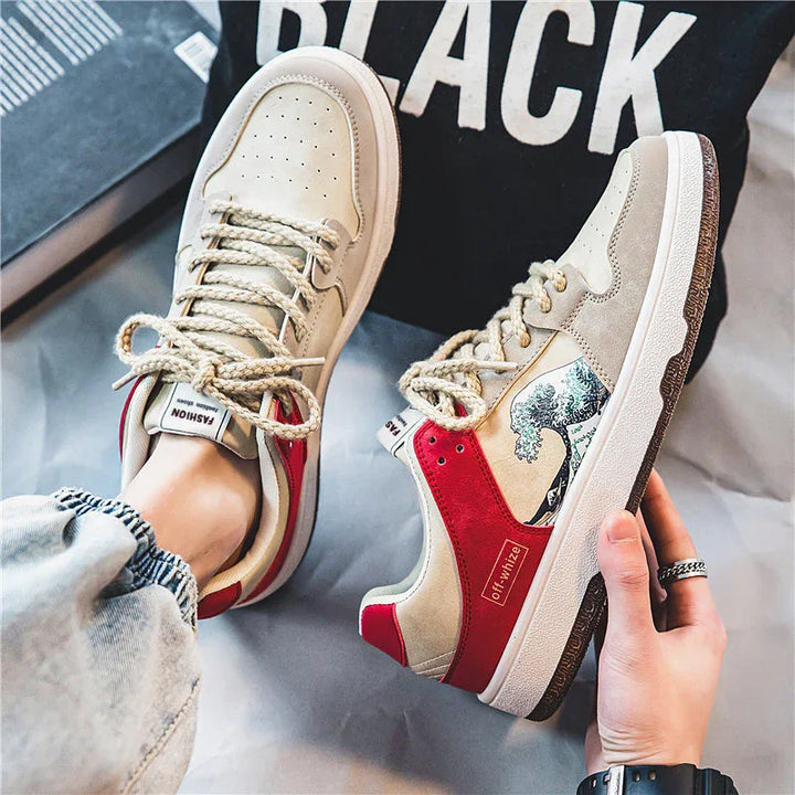 Stylish beige and red sneakers with Japanese wave design, worn with casual jeans and black background