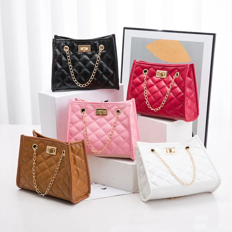 Collection of five quilted leather handbags in black, red, pink, brown, and white with gold chain straps