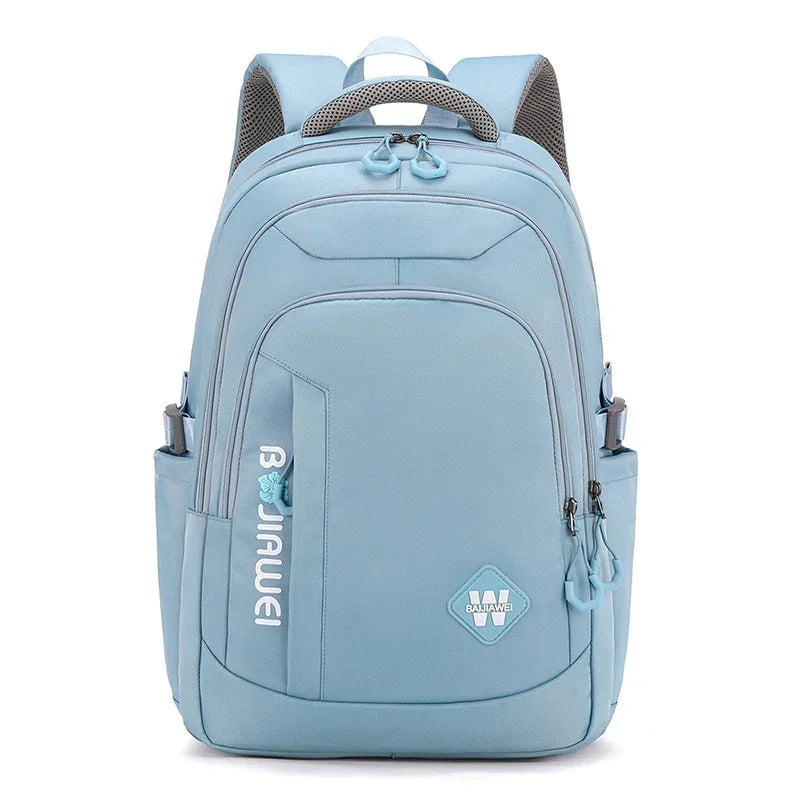 Light blue backpack with multiple zippered compartments and side pockets, padded straps, and logo patches
