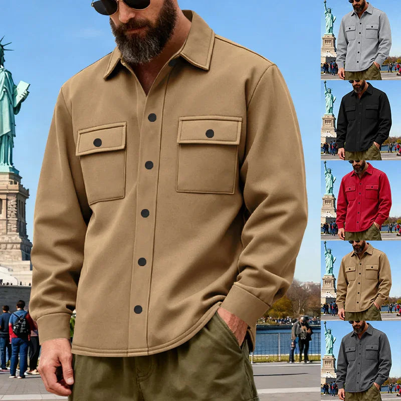 Man wearing beige casual button-up shirt with chest pockets near Statue of Liberty, outdoor urban setting