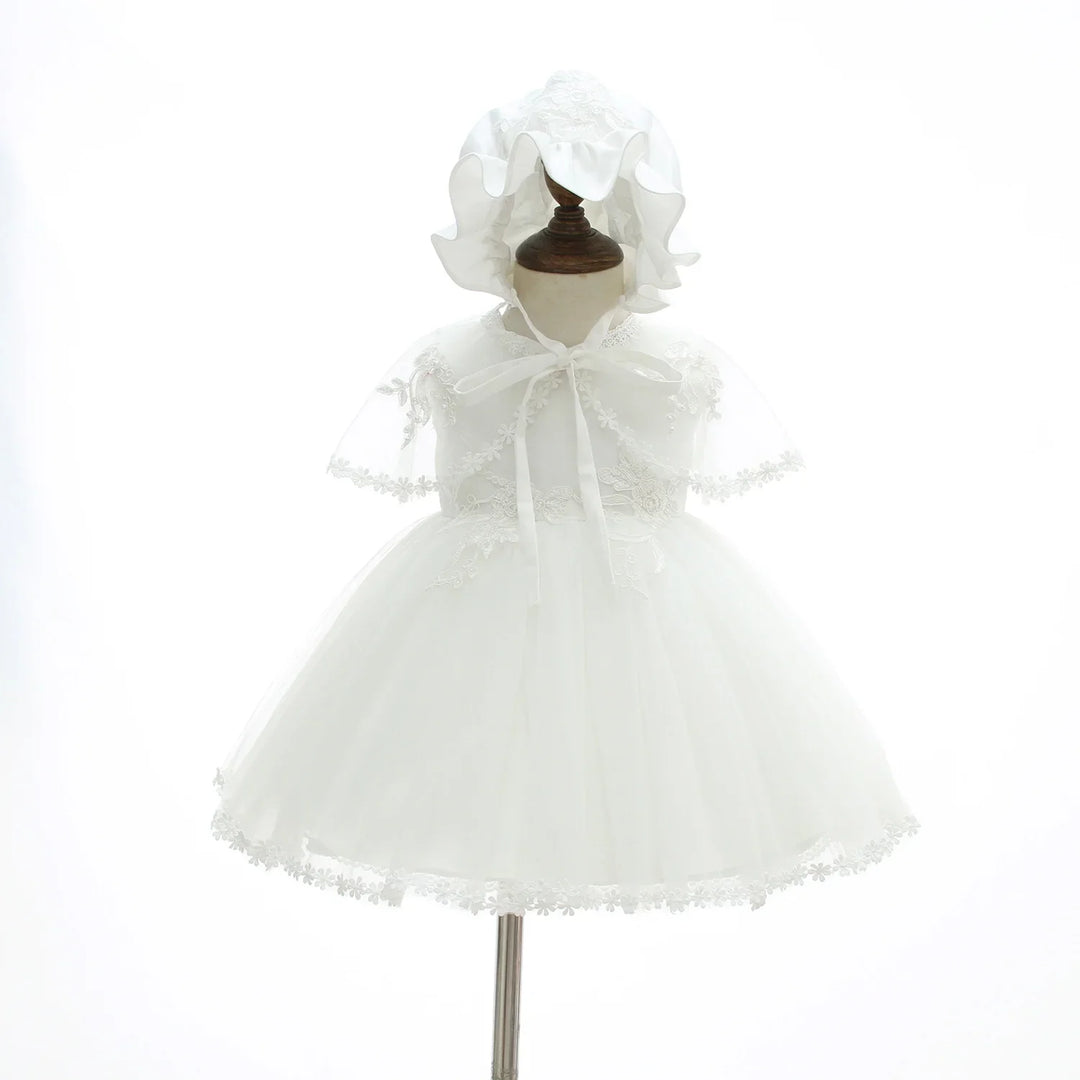 White baby girl christening dress with lace details and matching bonnet on mannequin