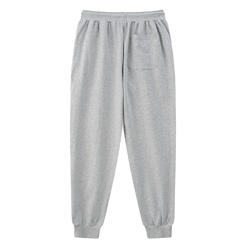 Light grey sweatpants with elastic waistband, cuffed ankles, and back patch pocket