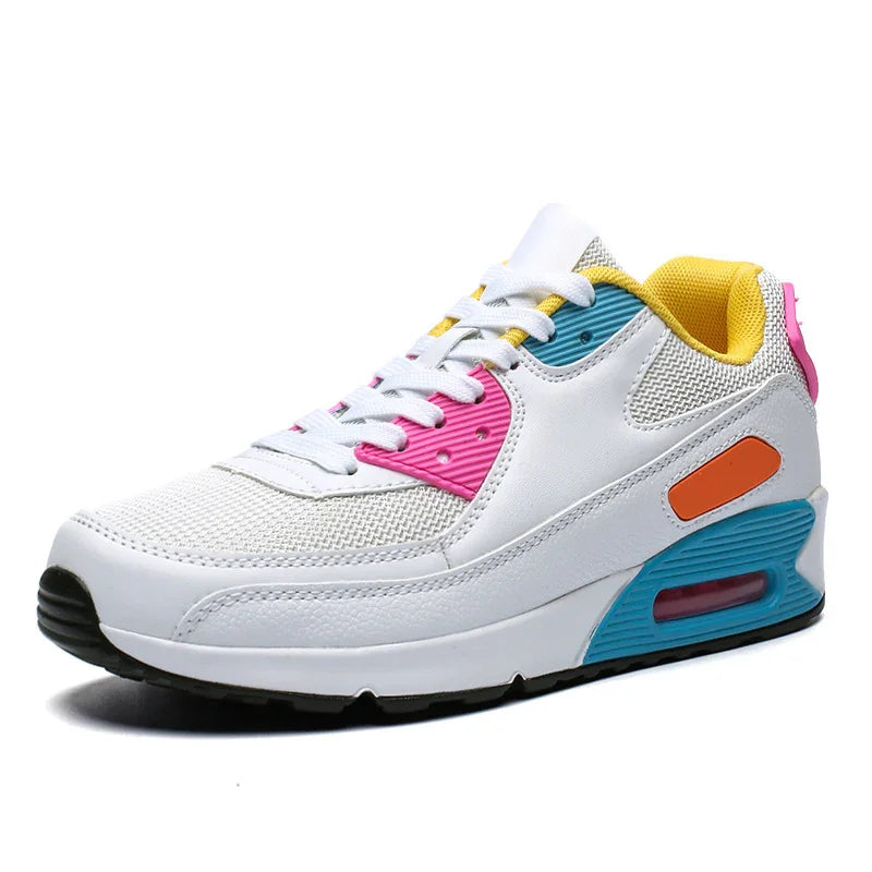 White athletic sneaker with pink, blue, orange, and yellow accents, mesh and leather design
