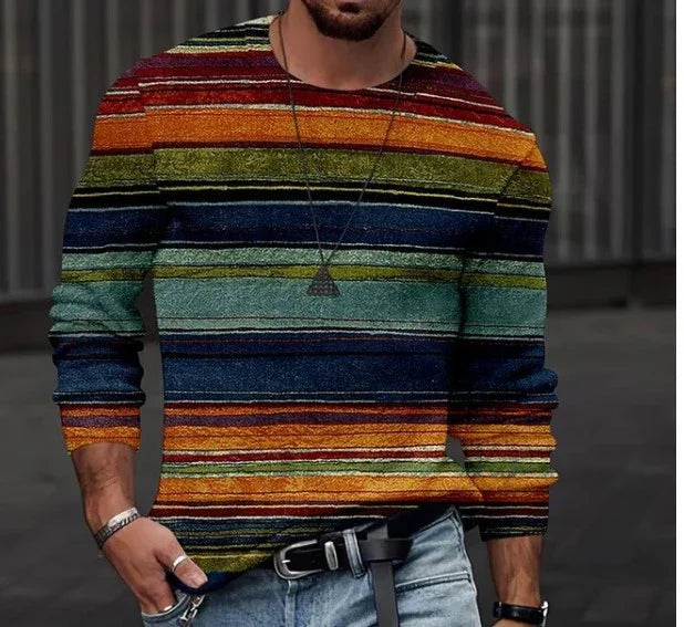 Man wearing colorful striped long-sleeve sweater with green, orange, blue stripes and casual jeans