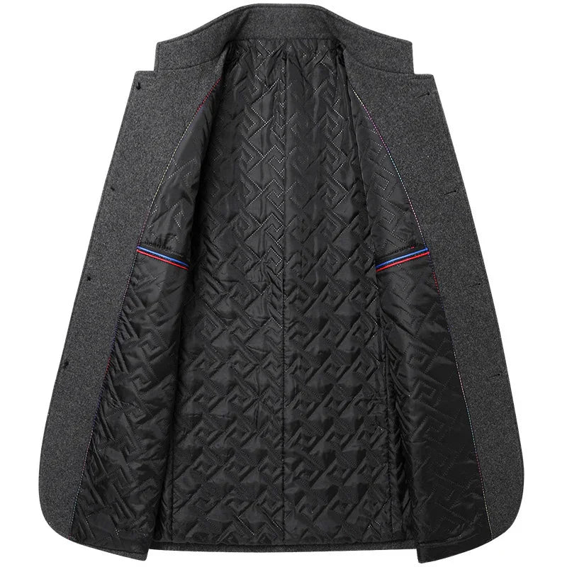 Open grey wool coat showing black quilted patterned interior lining with red and blue striped pocket edges