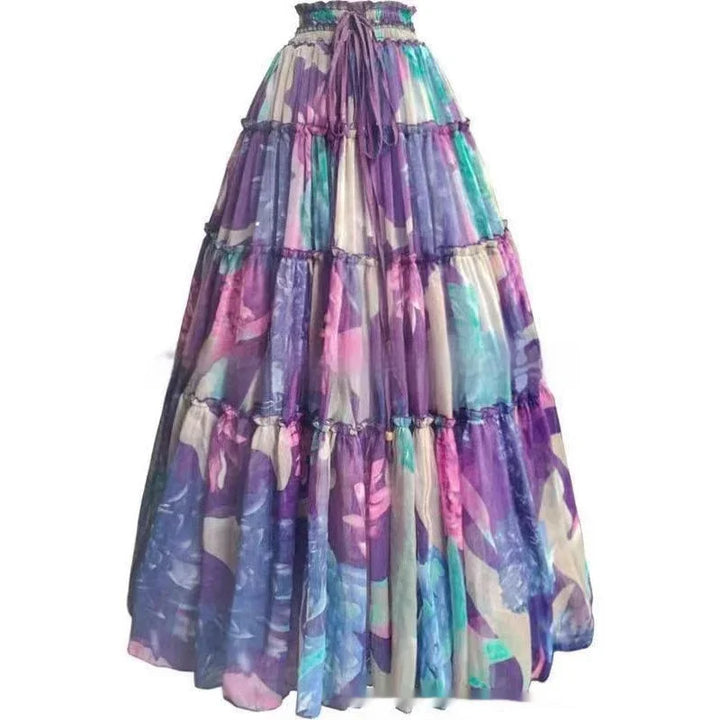 Bohemian tiered maxi skirt with purple, pink, and teal floral print and tie waist
