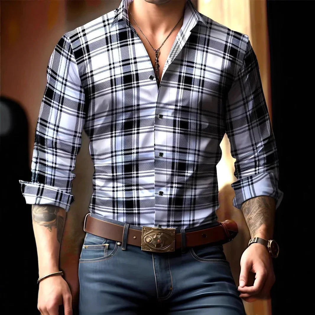 Man wearing fitted black and white plaid button-up shirt with rolled sleeves, brown belt, and blue jeans
