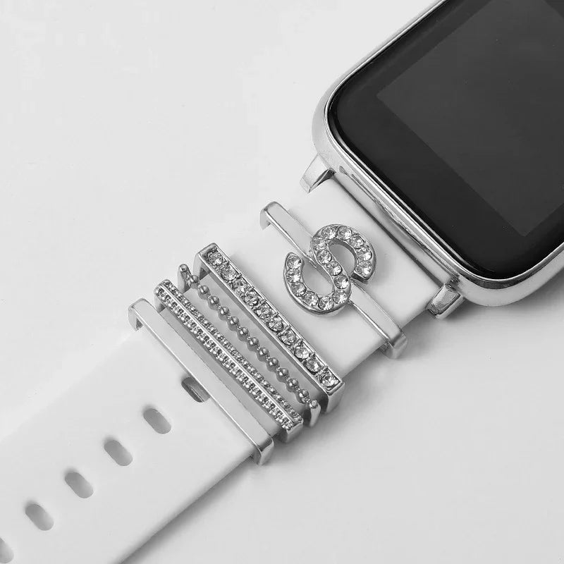 Smartwatch with white strap adorned with silver and rhinestone decorative charms
