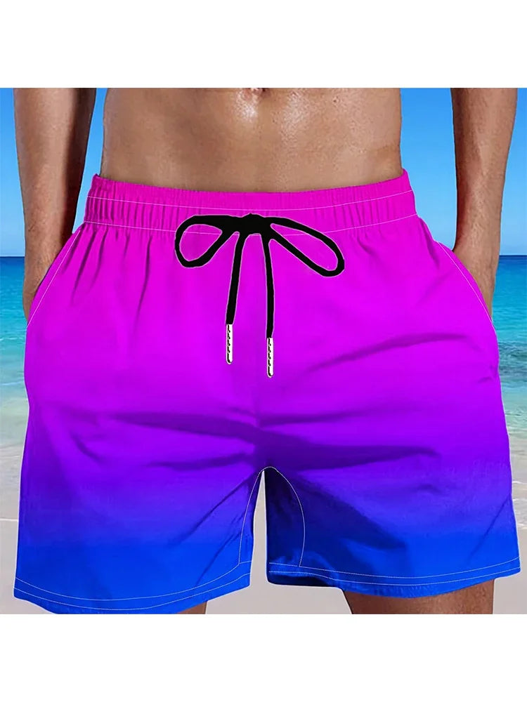 Men's swim shorts with purple to blue gradient and black drawstring at beach background