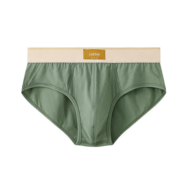 Green cotton men's briefs with beige waistband and label on white background
