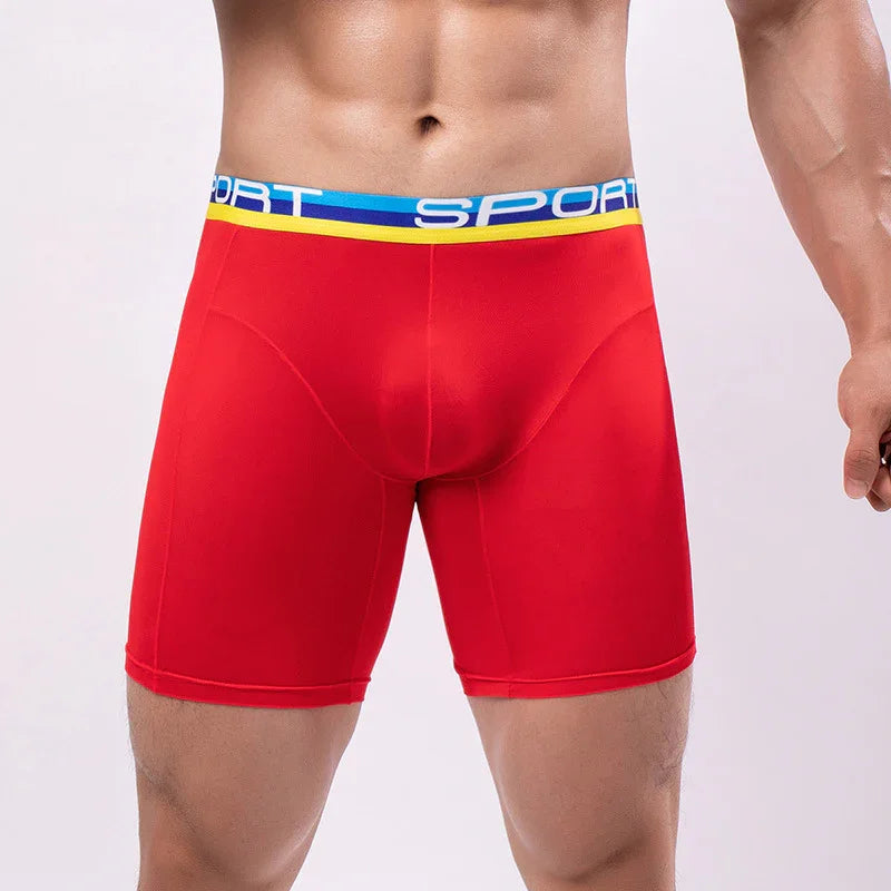 Men's red sports compression shorts with blue and yellow waistband labeled SPORT