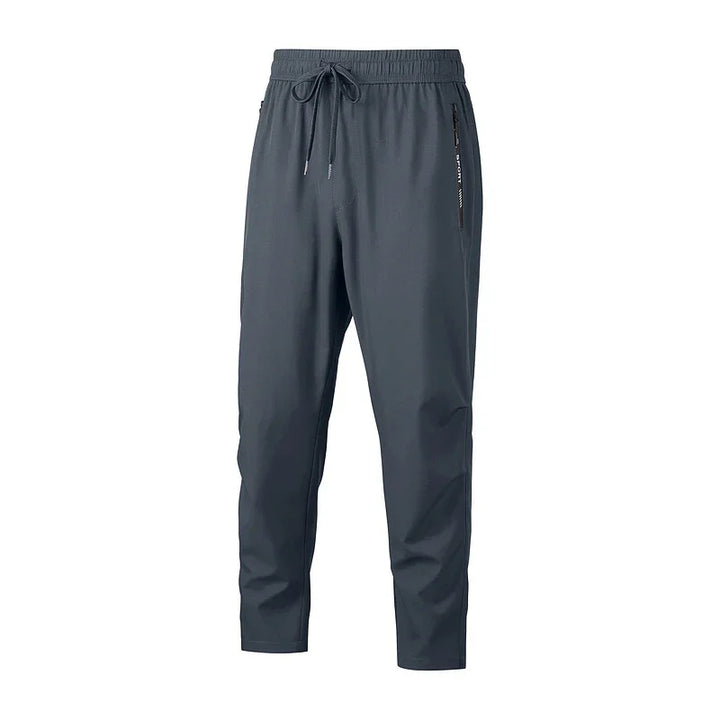 Men's dark gray lightweight jogger pants with elastic waistband and zippered side pocket
