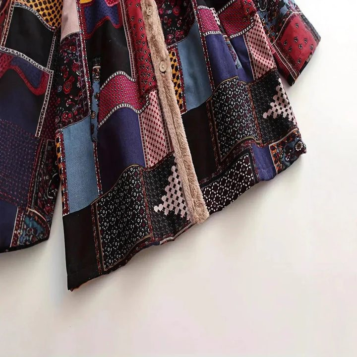 Colorful patchwork jacket with mixed patterns and a soft beige fur trim on the button placket