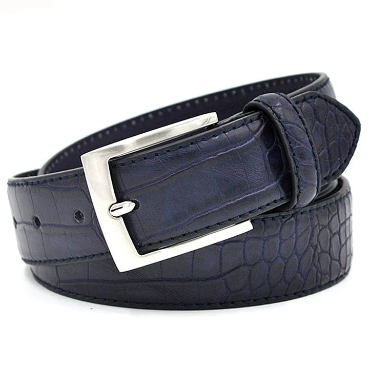 Black crocodile leather belt with silver rectangular buckle, rolled on white background