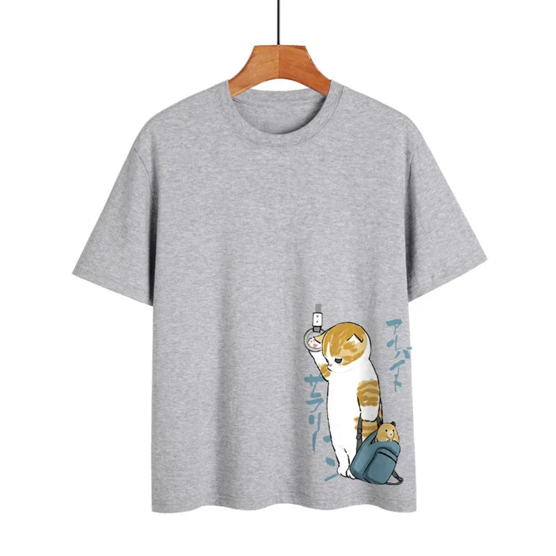 Grey t-shirt with cartoon cat holding subway strap and backpack with hamster print