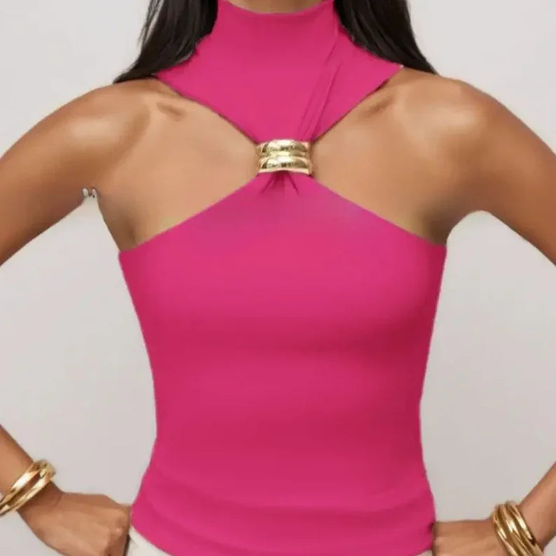Woman wearing sleeveless pink halter top with gold ring detail and matching gold bracelets