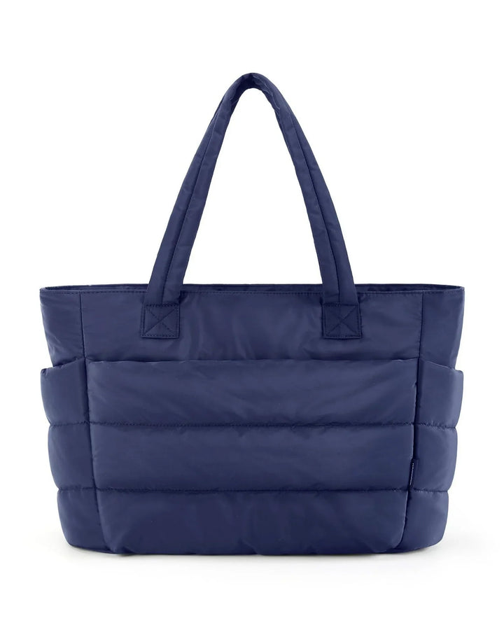 Navy blue padded tote bag with dual handles and side pockets on white background