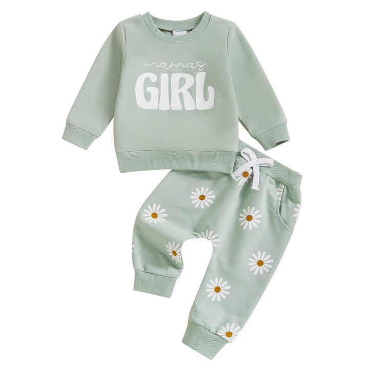 Light green toddler outfit with long sleeve sweatshirt reading 'mama's girl' and daisy print pants