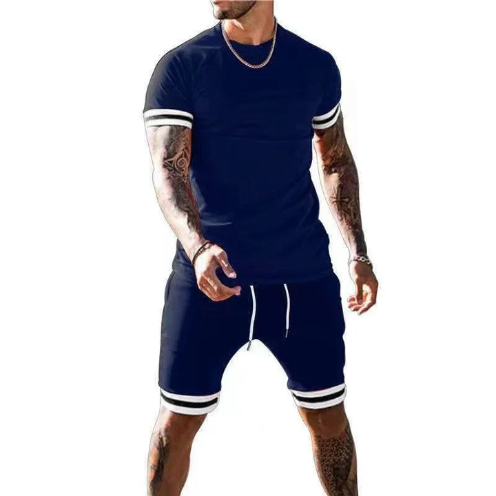 Man wearing navy blue athletic t-shirt and matching shorts with white stripes and drawstring
