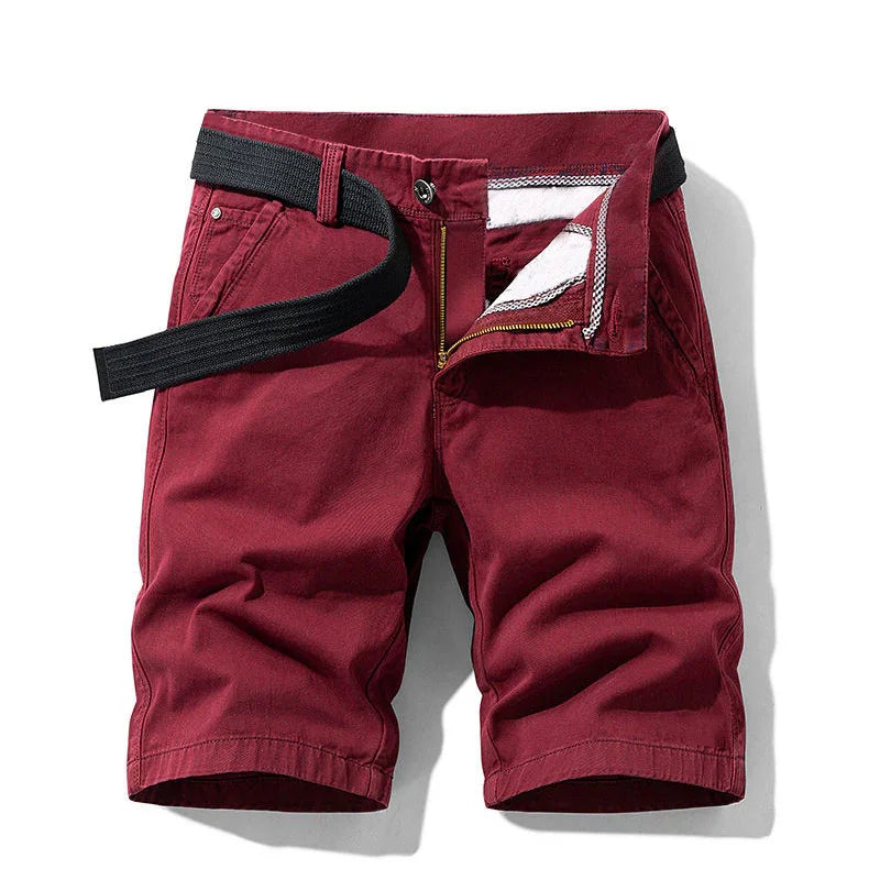 Men's casual burgundy shorts with front zipper and black woven belt on white background