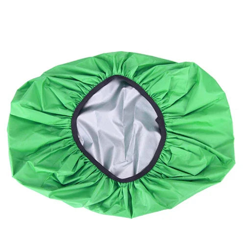 Green waterproof shower cap with elastic edge on white background