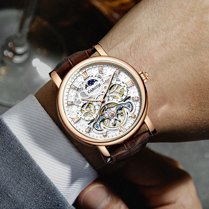 Carotif luxury skeleton watch with rose gold case and brown leather strap on a wrist